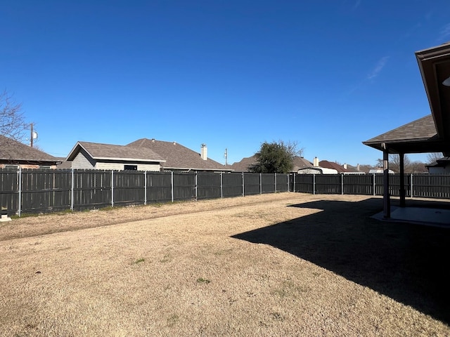 view of yard with a fenced backyard