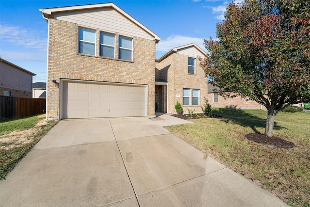 view of front property with a garage and a front lawn