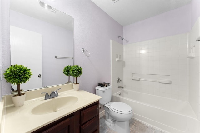 full bathroom with shower / tub combination, tile patterned floors, vanity, and toilet