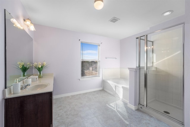 bathroom featuring tile patterned floors, vanity, and independent shower and bath