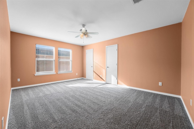 carpeted empty room featuring ceiling fan