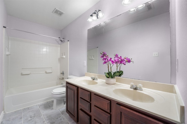 full bathroom with bathtub / shower combination, vanity, and toilet