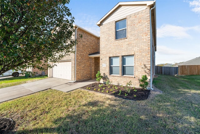 view of front property featuring a garage and a front lawn