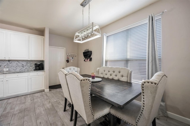 dining area featuring light wood-type flooring