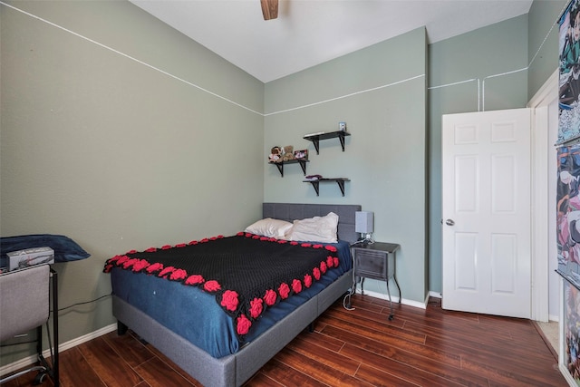 bedroom with ceiling fan and dark hardwood / wood-style floors