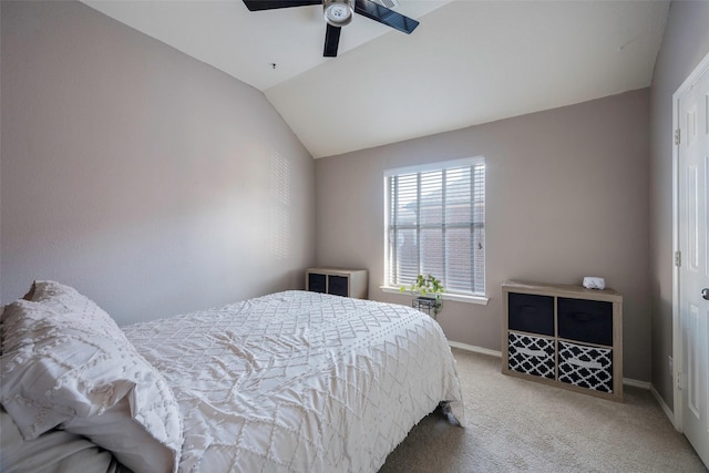 bedroom featuring carpet, ceiling fan, and vaulted ceiling