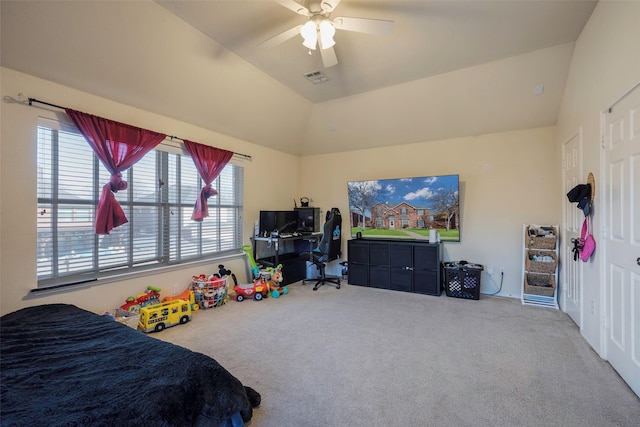 bedroom featuring ceiling fan, carpet floors, a tray ceiling, and vaulted ceiling