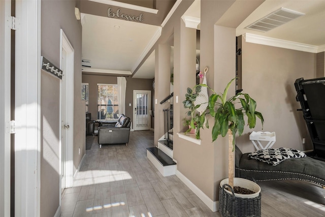 corridor featuring light hardwood / wood-style flooring and ornamental molding