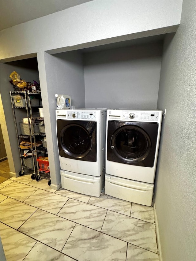 washroom featuring washer and dryer