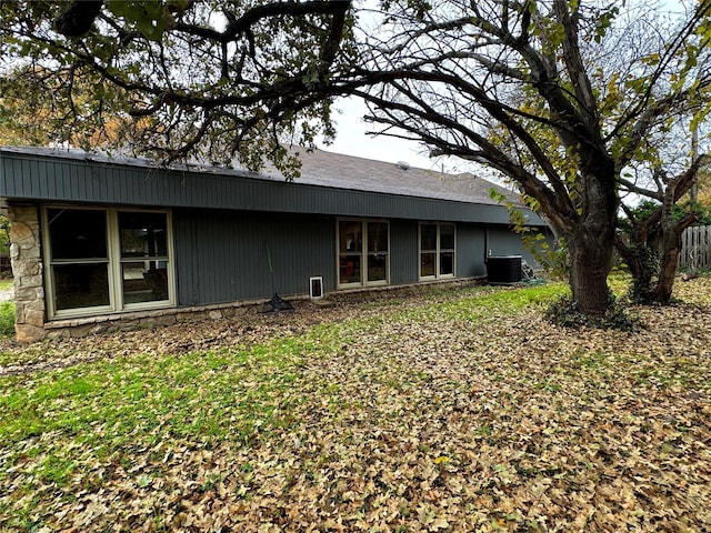 back of house featuring cooling unit