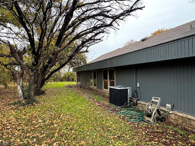 view of yard featuring central air condition unit