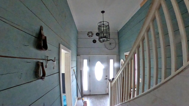 entryway with a chandelier and wood finished floors