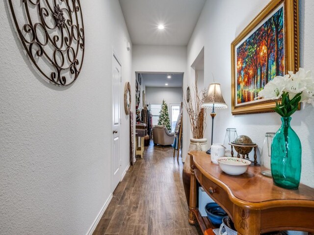 hall with dark wood-type flooring