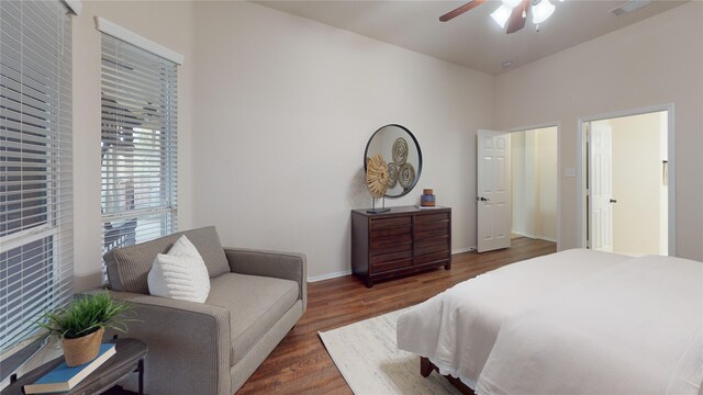 bedroom with ceiling fan and dark wood-type flooring