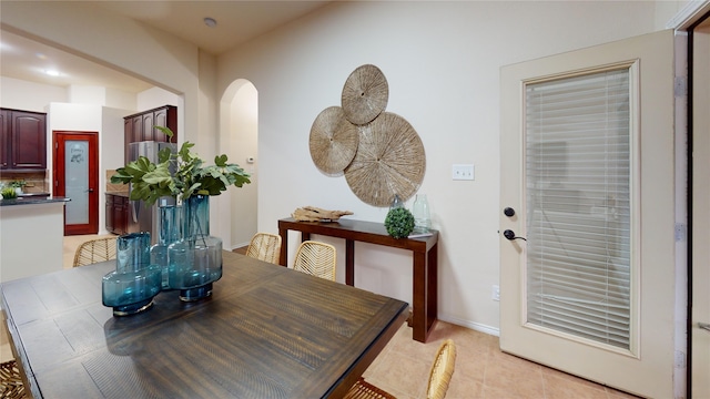 dining area featuring light tile patterned floors