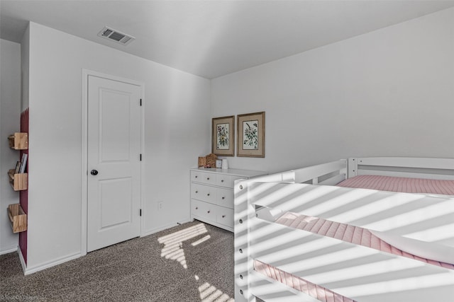 bedroom featuring dark colored carpet