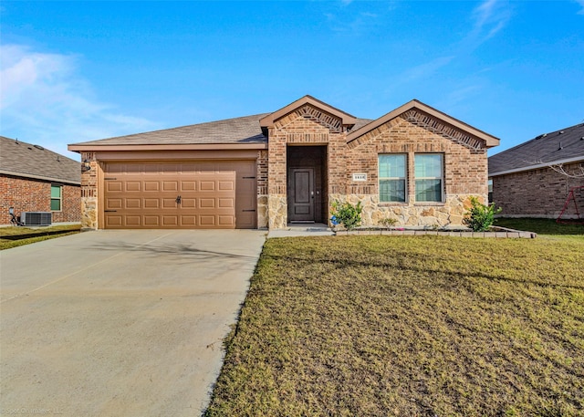 ranch-style house with a front lawn, a garage, and central AC