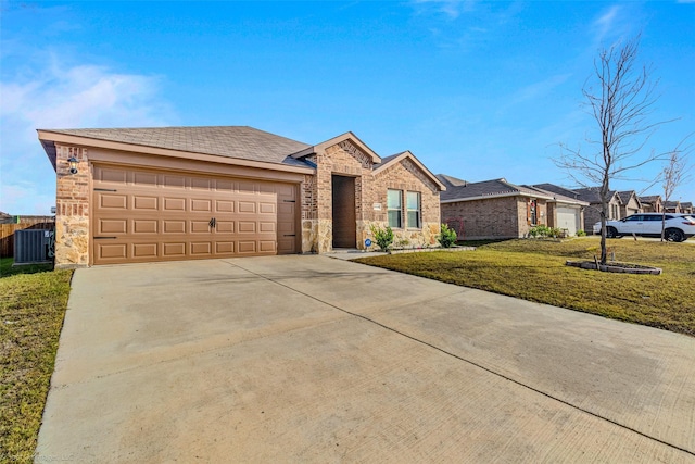 single story home with central AC, a garage, and a front lawn