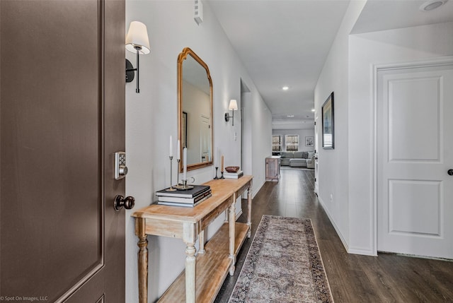 hall with dark hardwood / wood-style flooring