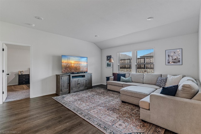 living room with dark wood-type flooring and vaulted ceiling