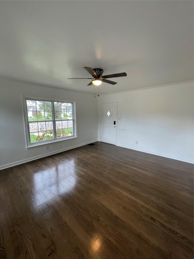 empty room featuring dark hardwood / wood-style floors and ceiling fan