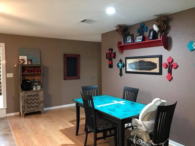 dining space featuring hardwood / wood-style flooring