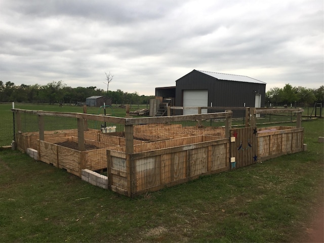 view of stable featuring a rural view