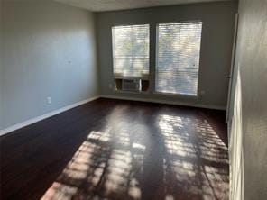 spare room with hardwood / wood-style floors and cooling unit