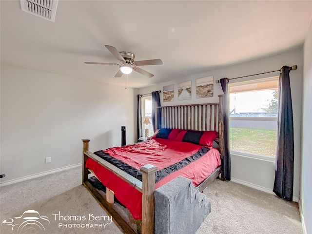 carpeted bedroom with ceiling fan