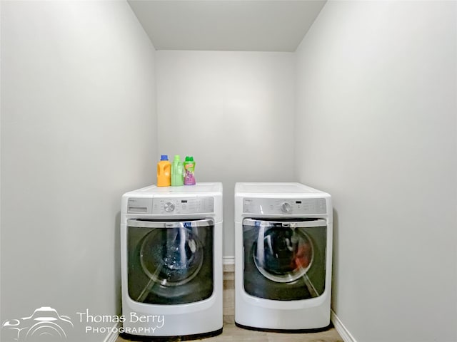 washroom with separate washer and dryer