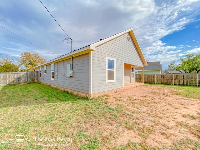 view of home's exterior with a yard