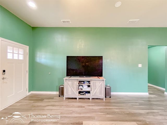 unfurnished living room with light hardwood / wood-style flooring