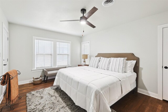 bedroom featuring ceiling fan and dark wood-type flooring