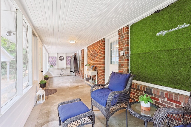 sunroom / solarium featuring wood ceiling