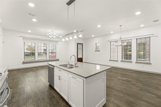 kitchen with white cabinetry, sink, hanging light fixtures, dark hardwood / wood-style floors, and an island with sink