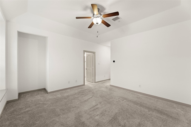 empty room featuring light carpet and ceiling fan