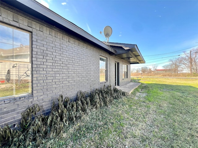 view of home's exterior featuring a yard