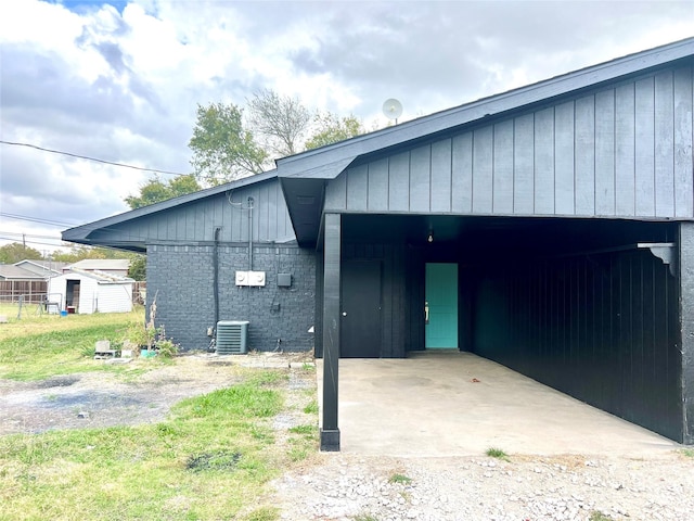 exterior space with a carport and central air condition unit