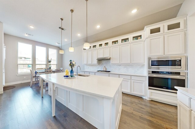 dining space with dark hardwood / wood-style flooring and lofted ceiling