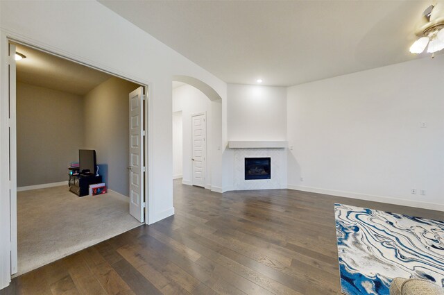 living room featuring ceiling fan and dark hardwood / wood-style flooring