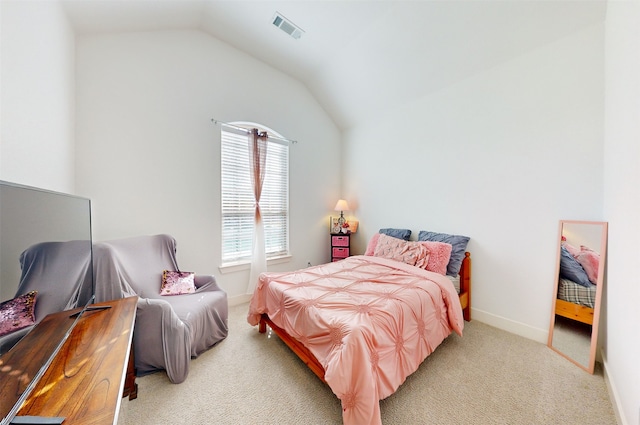 bedroom featuring light carpet and lofted ceiling