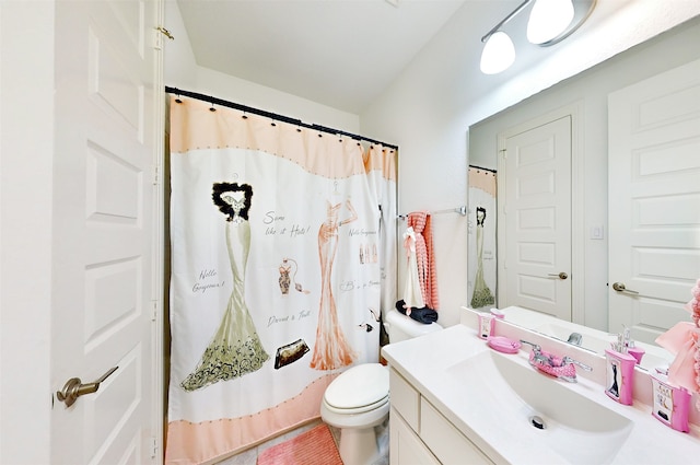 bathroom with vanity, toilet, and walk in shower