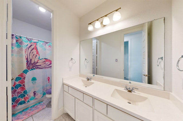 bathroom with tile patterned floors, vanity, and a shower with shower curtain