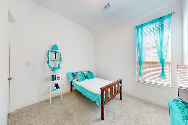 carpeted bedroom featuring vaulted ceiling