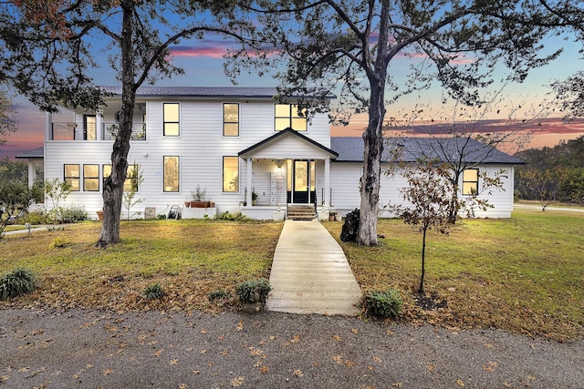 view of front of home with a yard