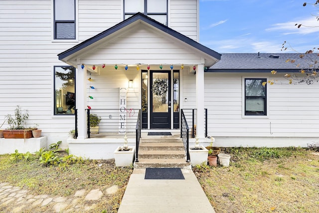 view of exterior entry featuring a porch