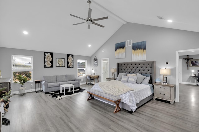 bedroom with ceiling fan, beam ceiling, high vaulted ceiling, and light hardwood / wood-style flooring