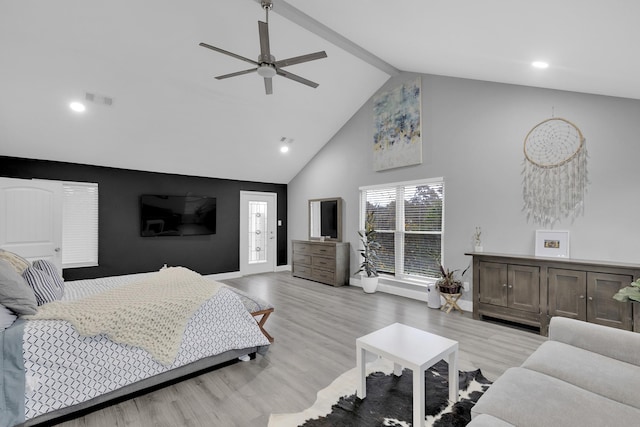 bedroom featuring ceiling fan, high vaulted ceiling, and light wood-type flooring