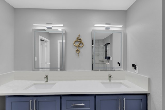 bathroom with vanity and a shower with shower door