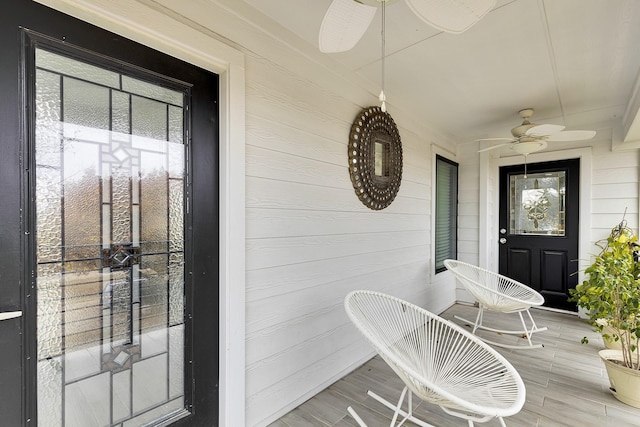 view of exterior entry featuring ceiling fan